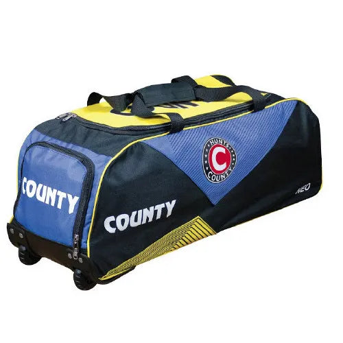 The Hunts County Neo Wheelie Cricket Bag in navy/yellow is ideal for cricketers, offering style and practicality as a wheeled holdall for your gear.
