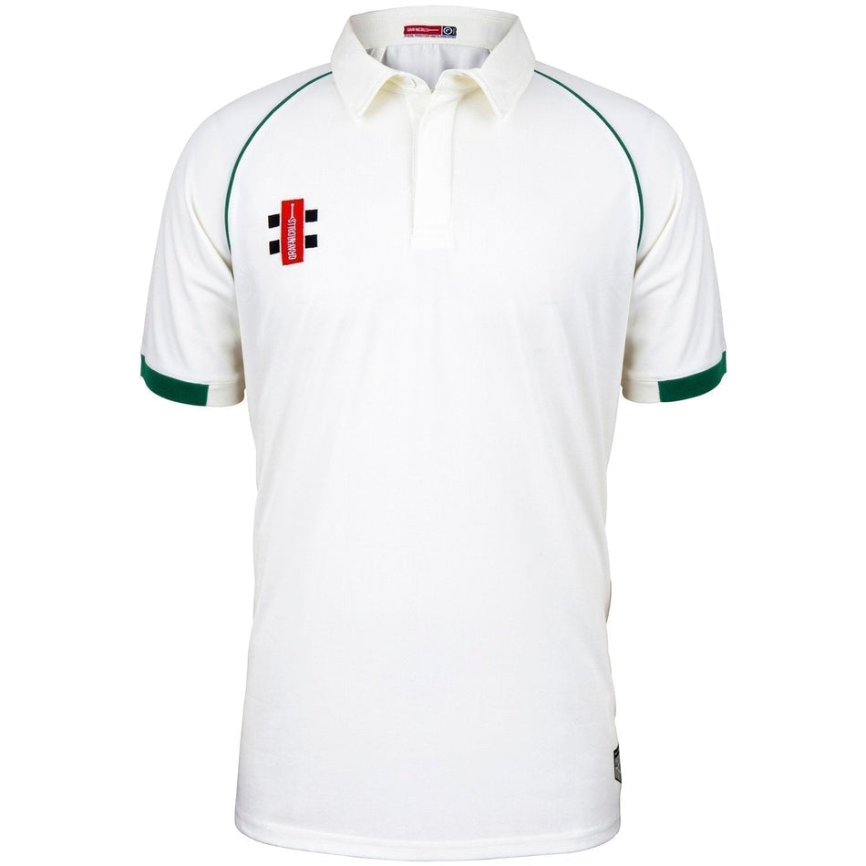 The Churchdown CC Matrix V2 Short Sleeve Match Shirt by Martin Berrill Sports is a white cricket shirt with dark green sleeve and shoulder trim, buttoned collar, and a red and black Churchdown CC logo on the left chest.