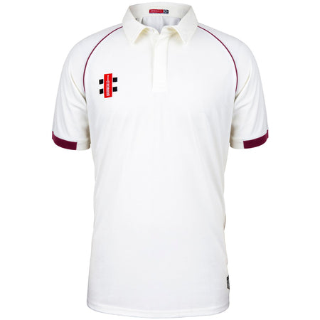 The Martin Berrill Sports Eastcombe CC Matrix V2 Short Sleeve Match Shirt is white with maroon trim on the sleeves and shoulders, featuring a collar, buttoned placket, and a small red and black logo on the left chest.