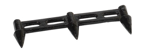 The Hunts County Cricket Stump Marking Gauge is a black metal tool with three triangular spikes and two elongated holes, designed for precise marking of cricket stump positions on the field.