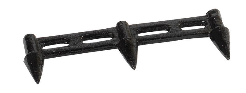 The Hunts County Cricket Stump Marking Gauge is a black metal tool with three triangular spikes and two elongated holes, designed for precise marking of cricket stump positions on the field.