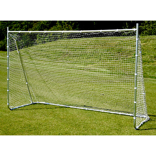 The Precision Training Precision Multi Sport Steel Goal, featuring a white net and zinc-coated steel frame, stands on a grassy field, blending effortlessly with the surrounding trees and greenery.