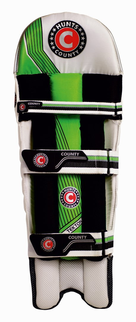 The Hunts County Tekton Junior Batting Pads feature a green, black, and white design with three black straps and Hunts County branding; these ambidextrous pads offer versatile protection for young cricket players.