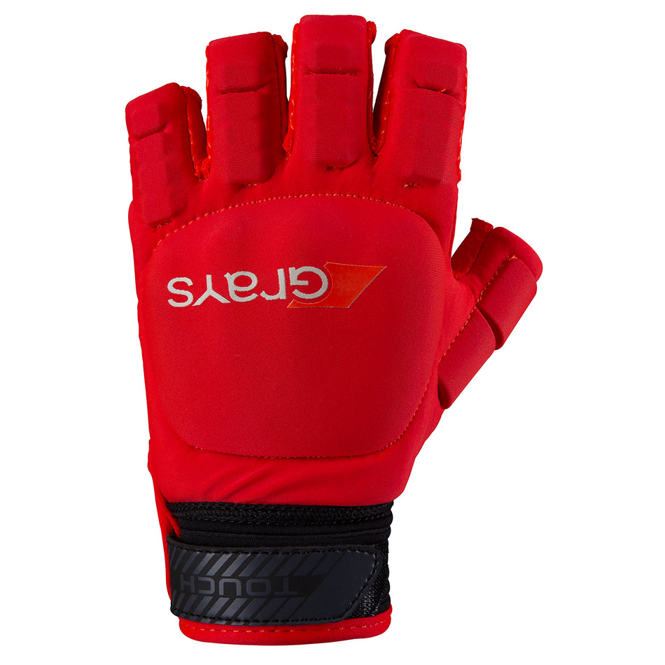 The Grays Touch Hockey Glove by Grays is shown in red with black and gray accents, featuring white GRAYS branding, exposed fingertips for dexterity, and knuckle armor for protection—ideal for flexible grip and stick handling.