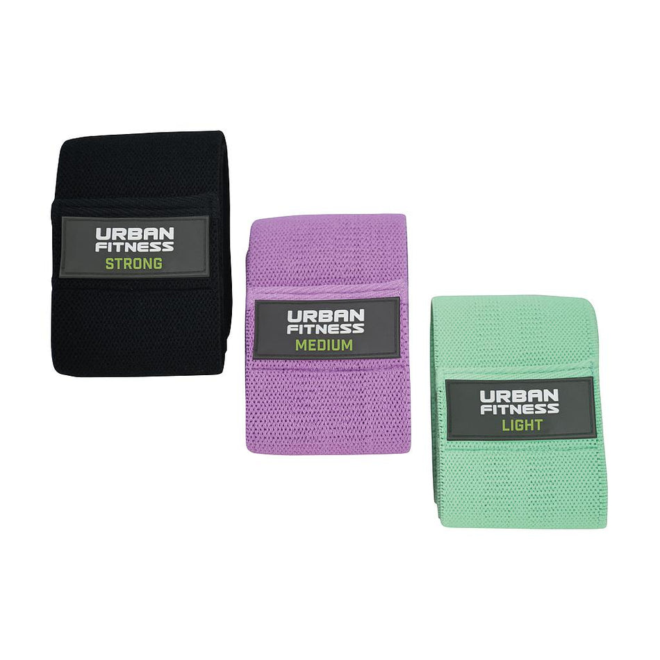 The Urban Fitness Fabric Resistance Band Loop Set of 3 (15 Inch) includes black (Strong), purple (Medium), and mint green (Light) bands, each marked with its resistance level—ideal for any workout collection.