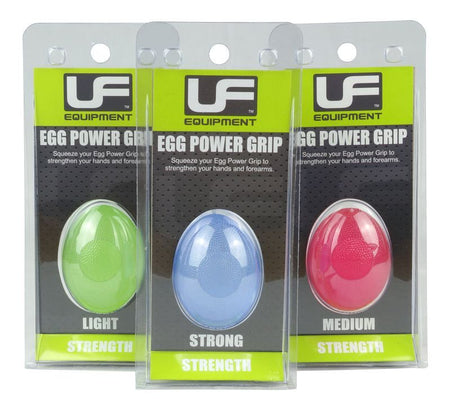 Three Urban Fitness Egg Power Grip hand exercisers by Urban Fitness—green (light), blue (strong), and red (medium)—are displayed upright in clear plastic boxes, ideal for stress relief and forearm strength training.