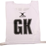 The Gilbert Netball Bibs in white feature bold black GK letters on the front, the Gilbert logo above, and elastic side straps for comfort. Made from breathable polyester—perfect for any netball bibs set.