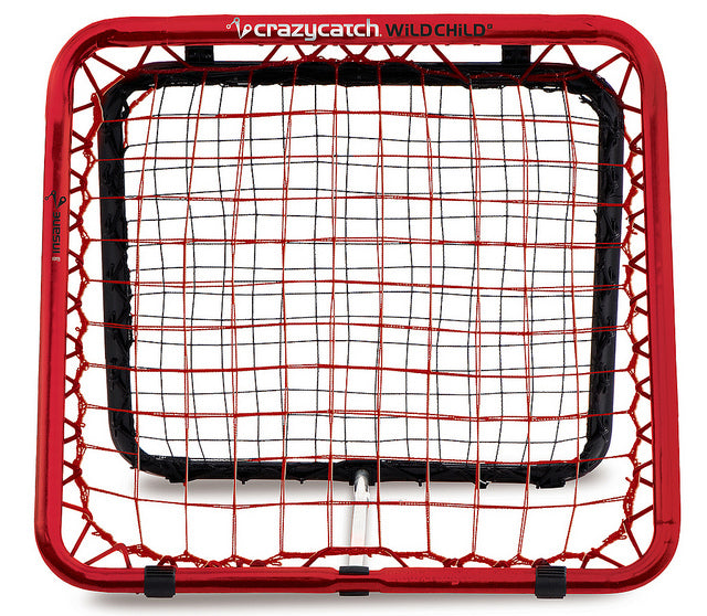 The Crazy Catch Wildchild Classic by Crazy Catch is a rectangular rebound net with a red frame and black bungee cords, designed to enhance hand-eye coordination and improve ball rebound practice for sports training.