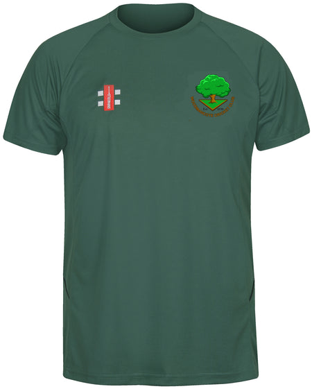 The Gray Nicolls Woodmancote CC Senior Matrix V2 T Shirt is a short-sleeved dark green tee with a tree and cricket bat logo on the left chest, white stripes with red on the right, designed for moisture-wicking during intense training.