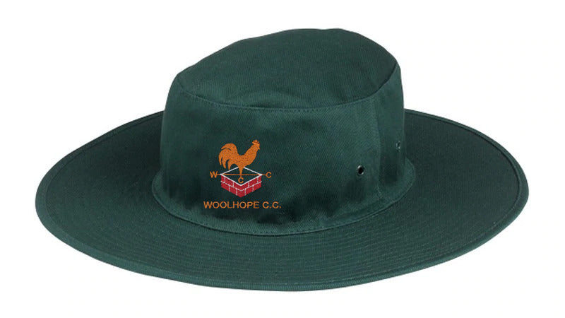 The Hunts County Woolhope CC Cricket Sunhat is dark green with a wide brim, featuring an orange rooster logo above red bricks and "WOOLHOPE CC" embroidered on the front.