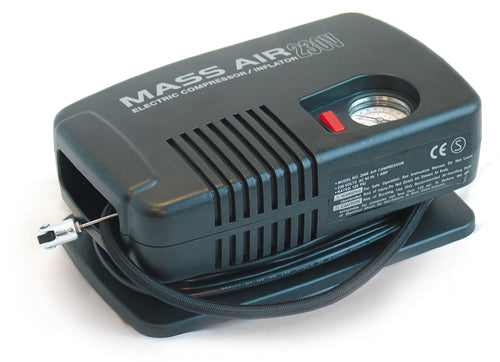 A black Precision Electric Air Compressor by Precision Training with a durable motor, built-in pressure gauge, attached hose, and plug sits on a white surface. Instructions, certification marks, and 150 psi specs appear on the side.