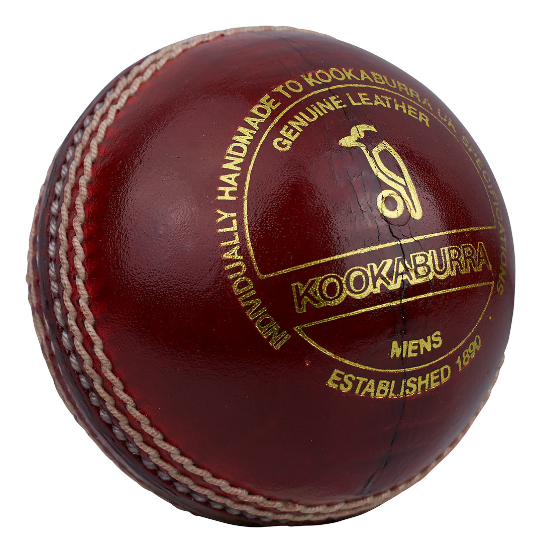 The Kookaburra County Star Cricket Ball is a red ball with white stitching, gold text branding, and a logo—crafted for durability and lasting play.