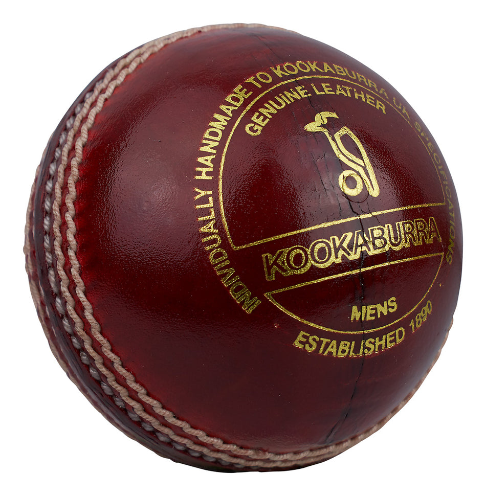 The Kookaburra County Star Cricket Ball is a red ball with white stitching, gold text branding, and a logo—crafted for durability and lasting play.