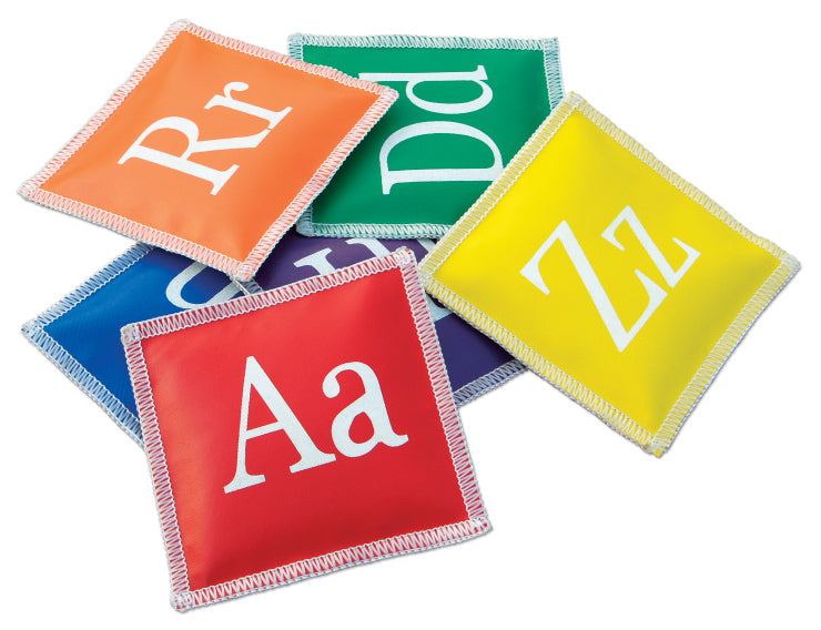 Five colorful Reydon Sports Alphabet Bean Bags (Pack of 26), featuring white letters on red, orange, green, yellow, and blue bags, are arranged overlapping for a playful educational display.