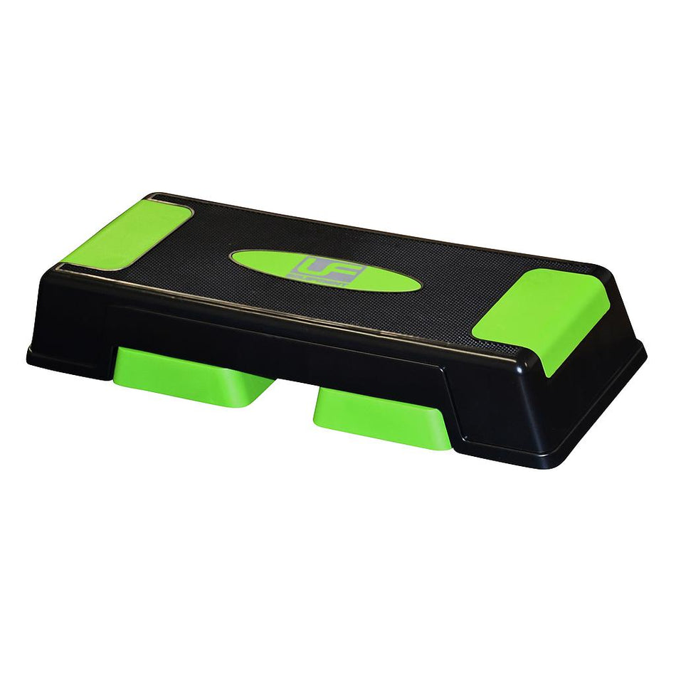 The Urban Fitness Adjustable Aerobic Step by Urban Fitness features black and green design, textured non-slip surface, and green end panels—ideal for fitness workouts, step exercises, and enhancing cardiovascular endurance.