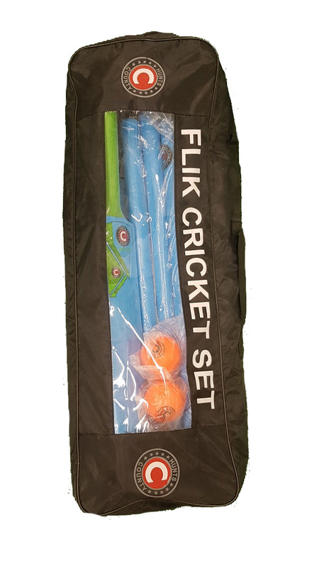 The Hunts County Flik Cricket Set (Full) by Hunts County is a black sports bag with a transparent front, showing plastic bats, orange balls, and green stumps—ideal as a junior practice kit.