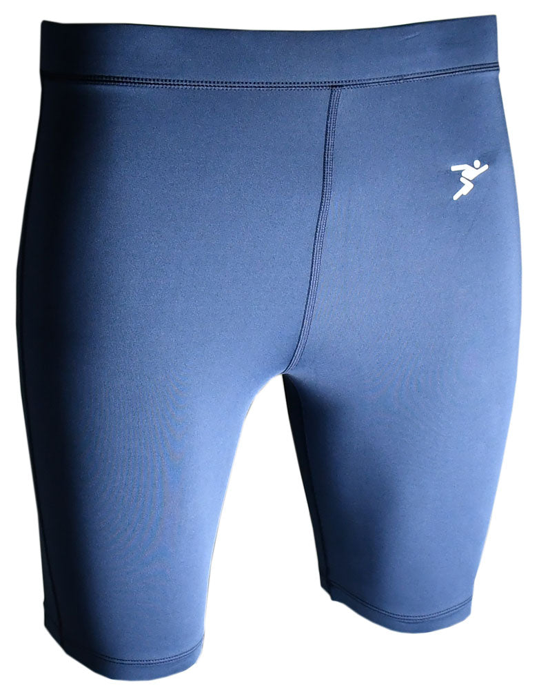 The Precision Training Precision Essential Baselayer Shorts Junior are navy compression shorts with visible stitching and a white abstract logo on the upper left thigh. They offer muscle recovery support and sit slightly above the knee.