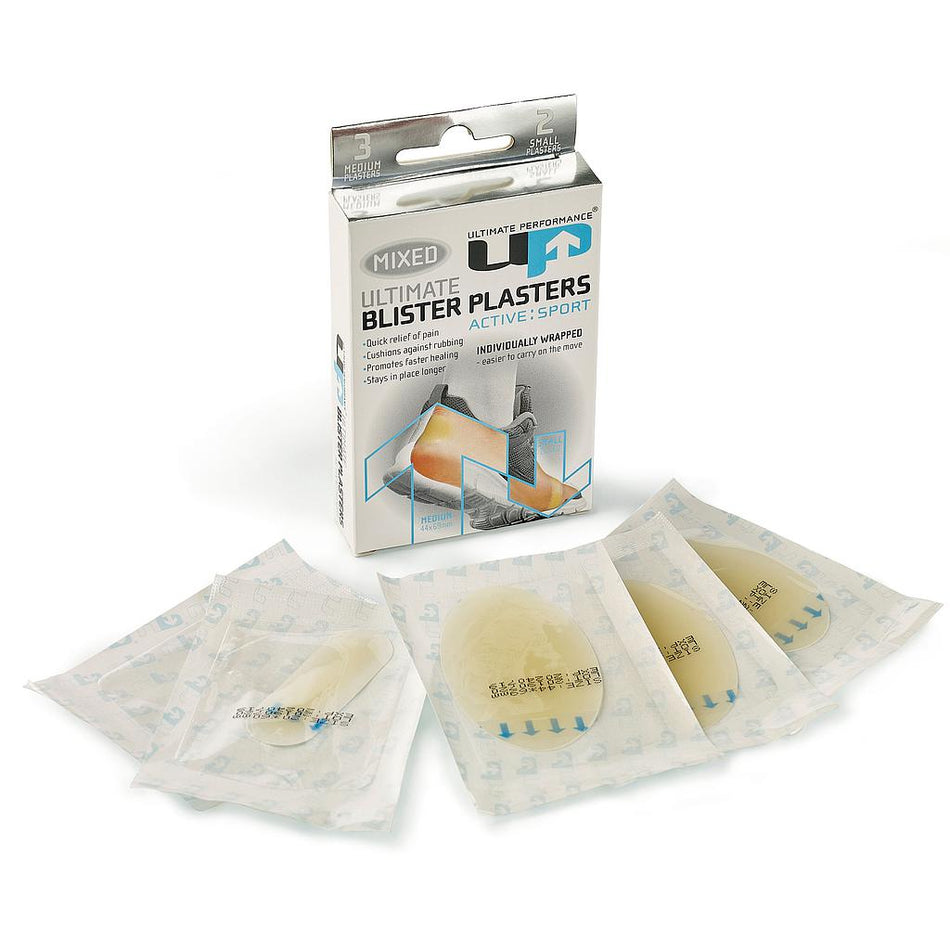 A box labeled Ultimate Performance Blister Plaster Mixed from Reydon Sports is displayed with five individually wrapped hydrocolloid plasters in front, emphasizing sport use and targeted blister relief.