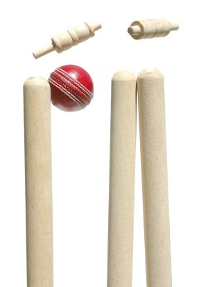 A red cricket ball strikes Hunts County English Ash County Stumps 27, causing the bails to fall against a white background.