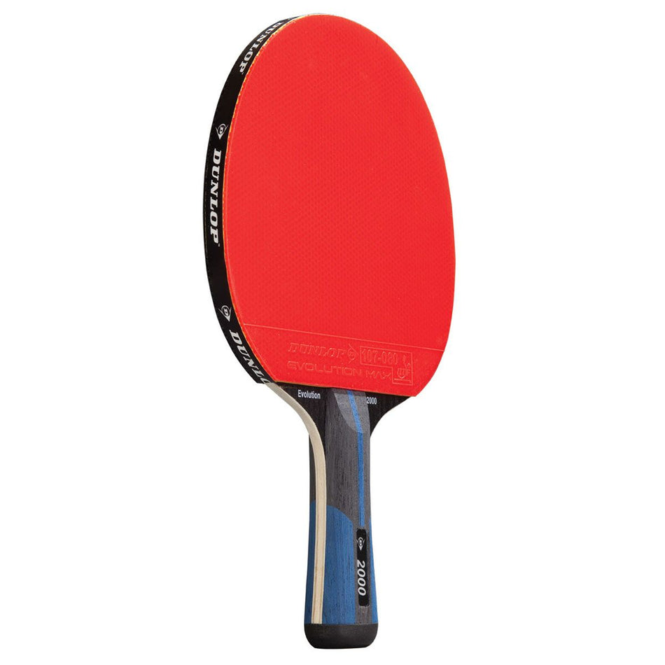 The Dunlop Evolution 2000 Table Tennis Bat by Dunlop features ITTF rubber with a red side, a black edge band labeled Dunlop, and a handle patterned with blue and black stripes.