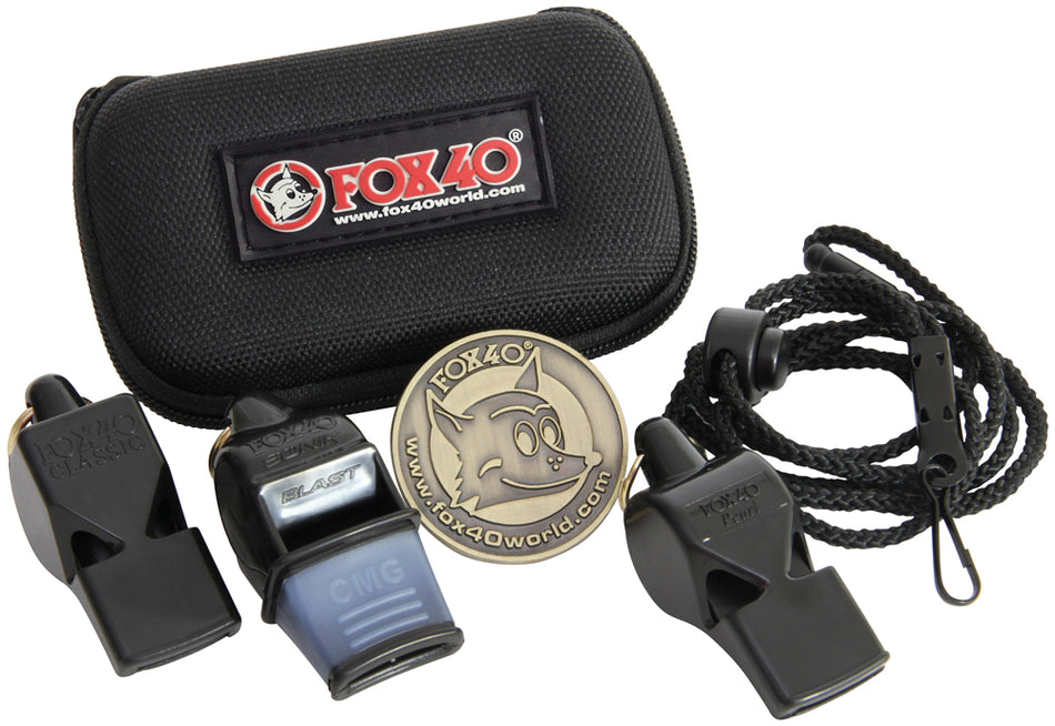 The Fox 40 3-Pack includes three pealess whistles, a lanyard, and a round Fox 40 logo badge, all displayed in front of a branded zippered pouch.