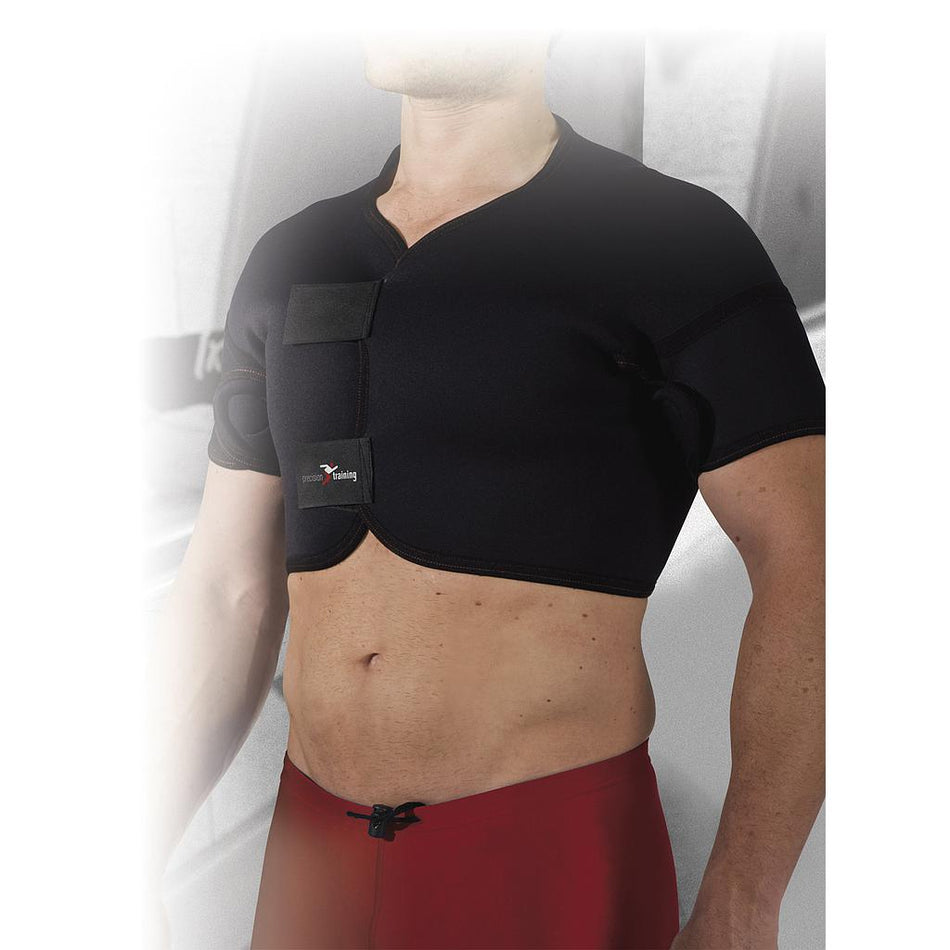 A person wears the Precision Training Precision Neoprene Full Shoulder Support with adjustable front-fastening straps over their upper body, paired with red shorts. The blurred gray background highlights relief from frozen shoulder.