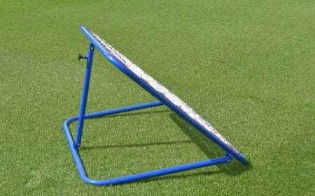 The Samba Sports Pro Rebounder, a blue metal net angled on green artificial grass, is perfect for first touch practice, passing, shooting drills, and goalkeeper coaching.