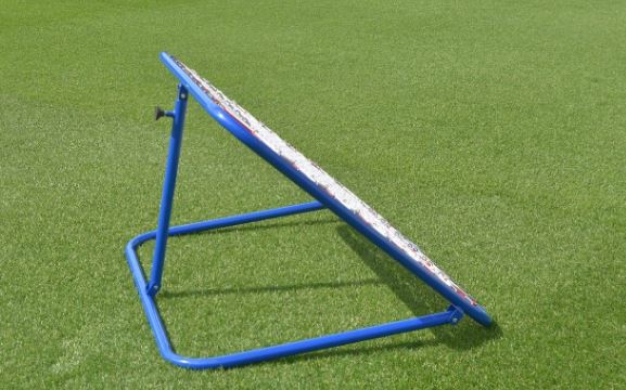 The Samba Sports Pro Rebounder, a blue metal net angled on green artificial grass, is perfect for first touch practice, passing, shooting drills, and goalkeeper coaching.