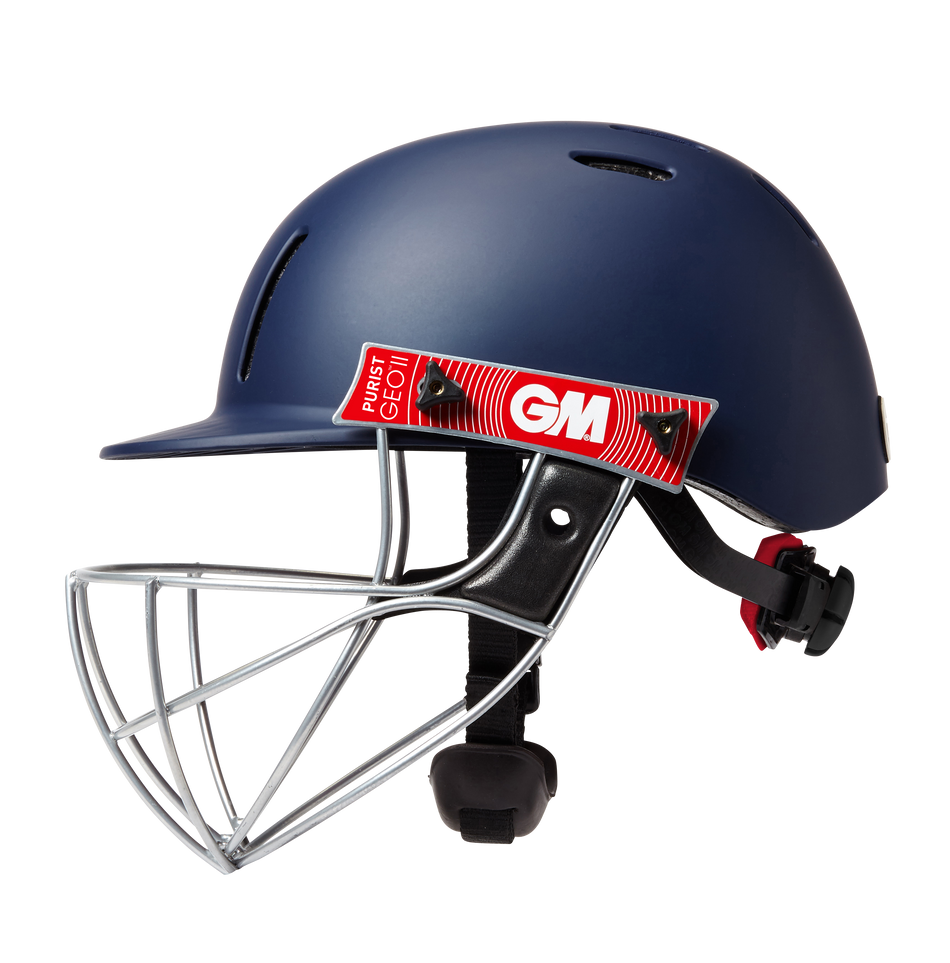 The Gunn & Moore Purist Geo II Navy Helmet features a Geo steel grille, black adjustable straps, a red GM logo sticker, air vents, and a chin protector for comfort and safety.