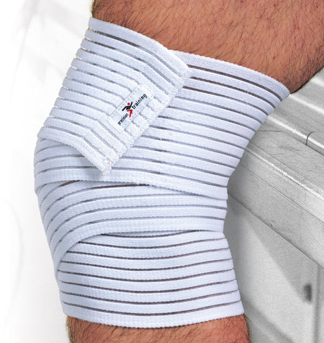 A close-up of a person’s elbow wrapped with the Precision Training Precision Elasticated Knee/Thigh Wrap - Universal, showing thin gray stripes and a small label. The arm rests on a light surface, ideal for everyday use or extra compression support.