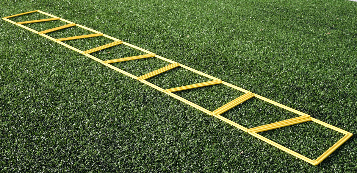 The Precision Training Precision Poly Grid System (set of 10) in yellow lies flat on green artificial grass, ideal for agility training and footwork drills.