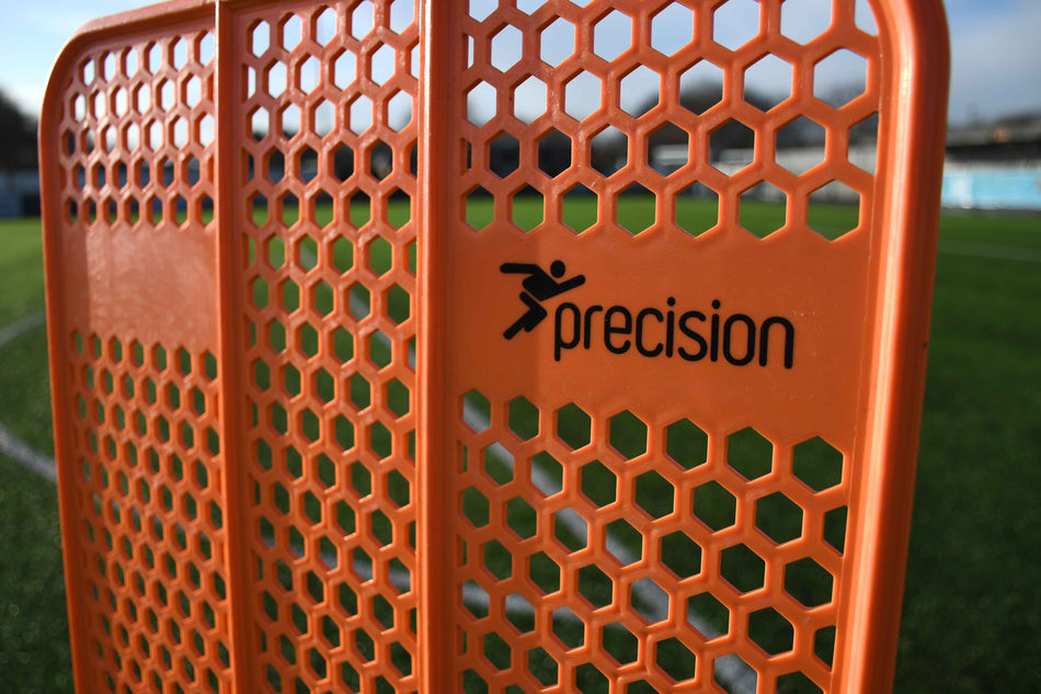 The Precision Training Pro HX Mannequin in orange features a honeycomb pattern, making it perfect for free kick training on the soccer field.