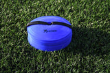 A stack of blue Precision Pro Near Flat Markers by Precision Training, held together with a black strap, rests on green artificial grass—ideal as soccer training markers. Set includes 40 low profile cones.