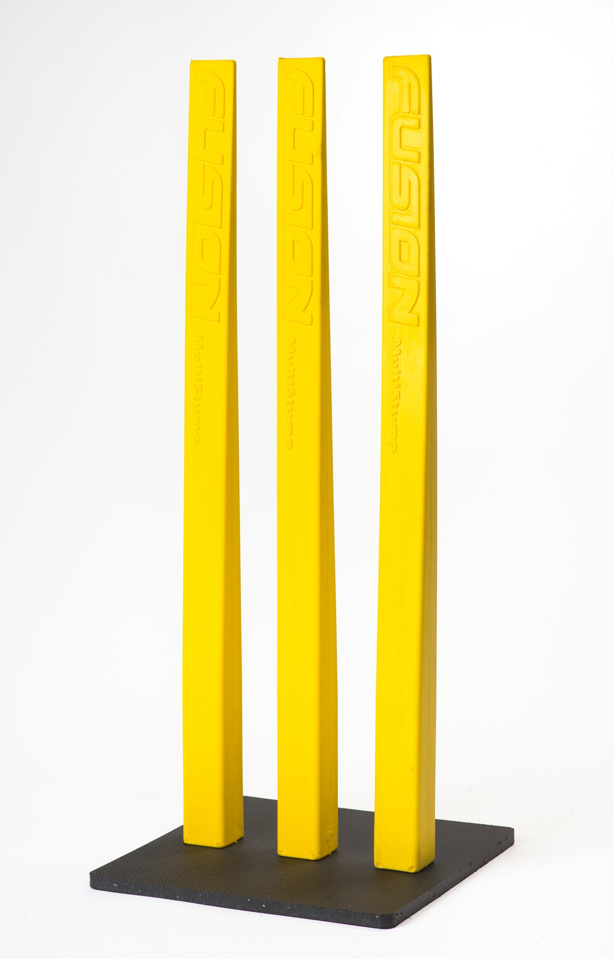 Three bright yellow Fusion Multi-Stump All Weather Base stumps, each embossed with "FUSION," stand upright on their durable base—perfect for hard wicket cricket—set against a plain white background.