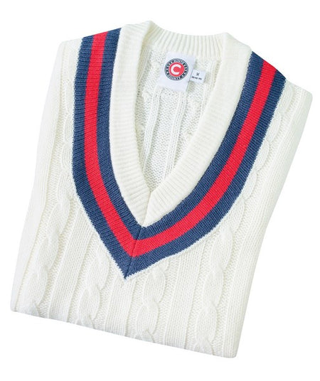 The Hunts County Trimmed Cricket Sweater is a folded white sweater with a deep V-neck and navy blue and red stripes along the neckline.