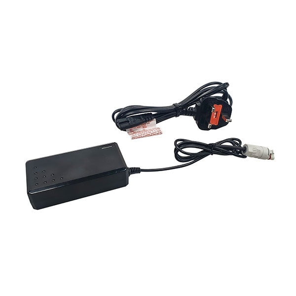 The Ritelite Sports Lite Fast Charger is a black rectangular charger with an attached cable and bundled UK three-pin power cord, featuring a white cylindrical connector—perfect for charging Sports Lite battery packs.