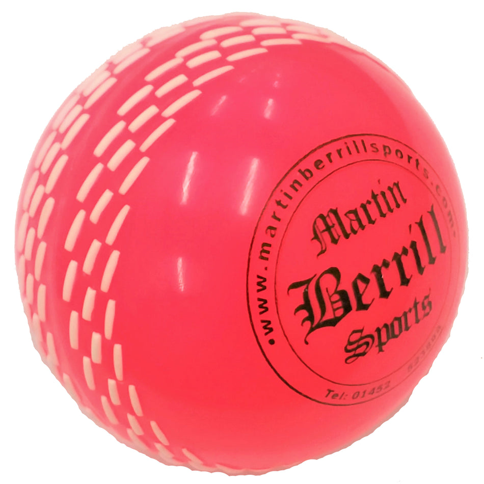 A vibrant pink ball from the Martin Berrill Sports Skill Ball Set features white dashes and “Martin Berrill Sports” printed in black on its surface.