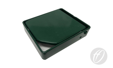 A dark green, rectangular Harrod Sport S8 Tennis Socket Raiser 25MM with a hinged lid, slightly open to show its white interior, sits on a white surface featuring a faint gray logo in the bottom right corner.