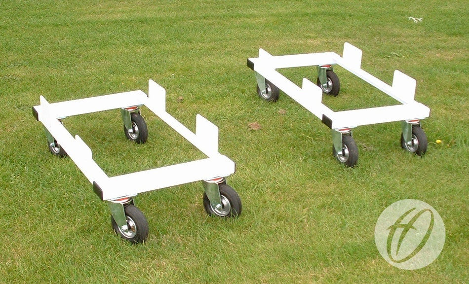 Two white Harrod Sport 3G Euro Portagoal Transporter Trolleys with four wheels and upturned steel edges are on green grass. Each trolley displays a circular logo in the corner. Supplied as a set of four.
