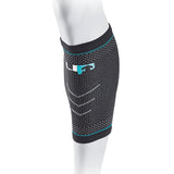 The Reydon Sports Ultimate Performance Ultimate Compression Elastic Calf Support, shown on a mannequin's lower leg, features black and gray fabric with blue accents and a white logo, designed for elastic support and injury recovery.