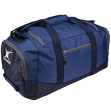 The Gilbert V3 Club Player Holdall by Gilbert is a navy duffel bag with a front zipper pocket, two handles, and the logo on the side—ideal as a sports kit bag for rugby or travel.