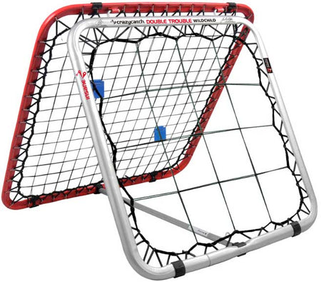 The Crazy Catch Wildchild Double Trouble by Crazy Catch is a double-sided rebound net with a red and silver frame and black bungee cords, designed to improve hand-eye coordination and ball skills during practice.