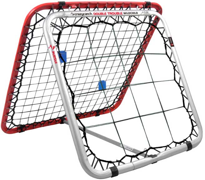 The Crazy Catch Wildchild Double Trouble by Crazy Catch is a double-sided rebound net with a red and silver frame and black bungee cords, designed to improve hand-eye coordination and ball skills during practice.