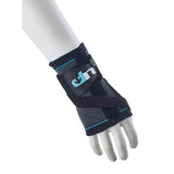 A mannequin hand displays the Reydon Sports Ultimate Performance Advanced Ultimate Compression Wrist Support in black and blue, featuring mesh material and adjustable straps for enhanced wrist support and stability.